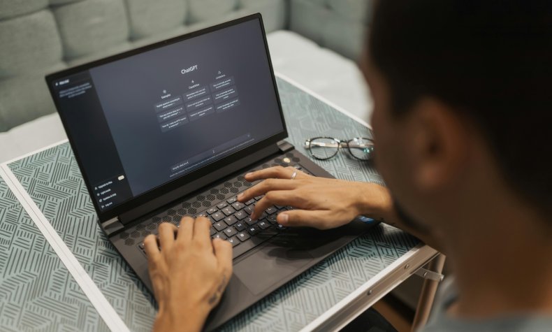 Man chatting with ChatGPT on his laptop