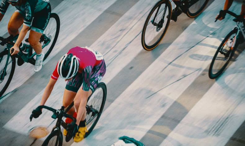 Bicyclists lagging behind lead racer