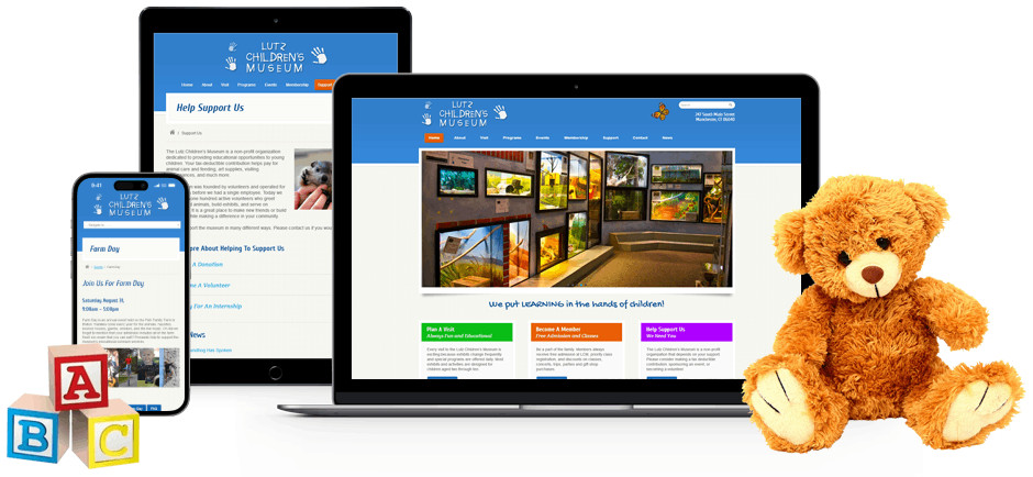 A tablet, smartphone, and laptop surrounded by building blocks and a teddy bear