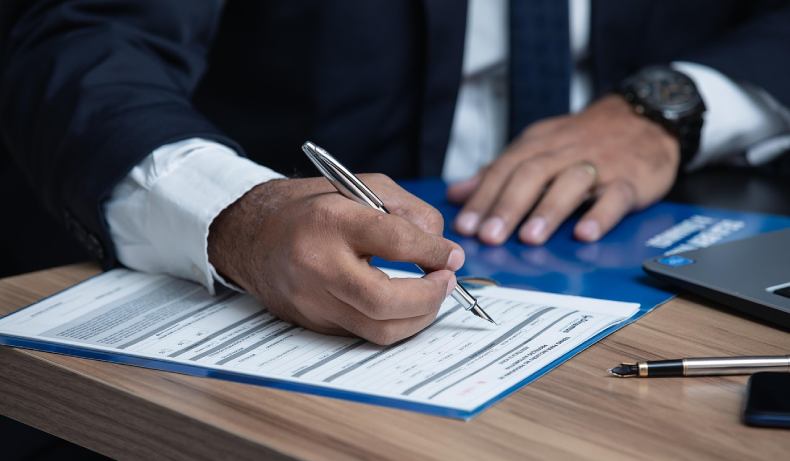 Attorney signing legal documents