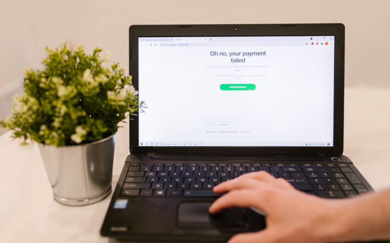 Laptop screen showing a website payment error