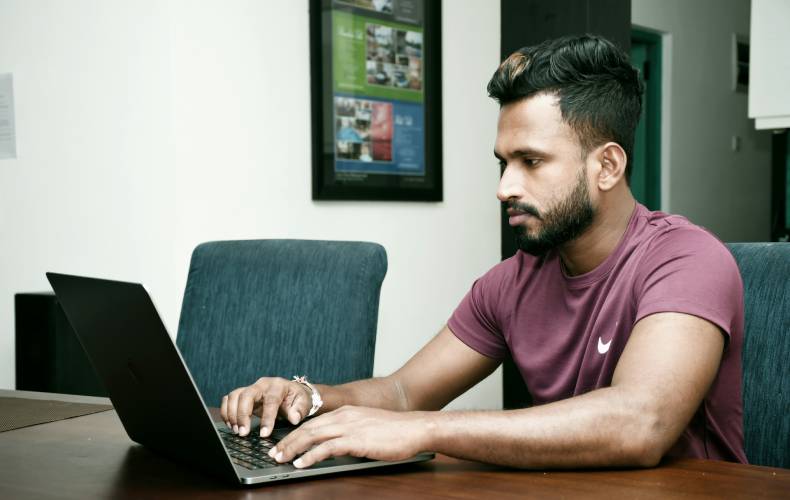 Business owner looking intently at his laptop