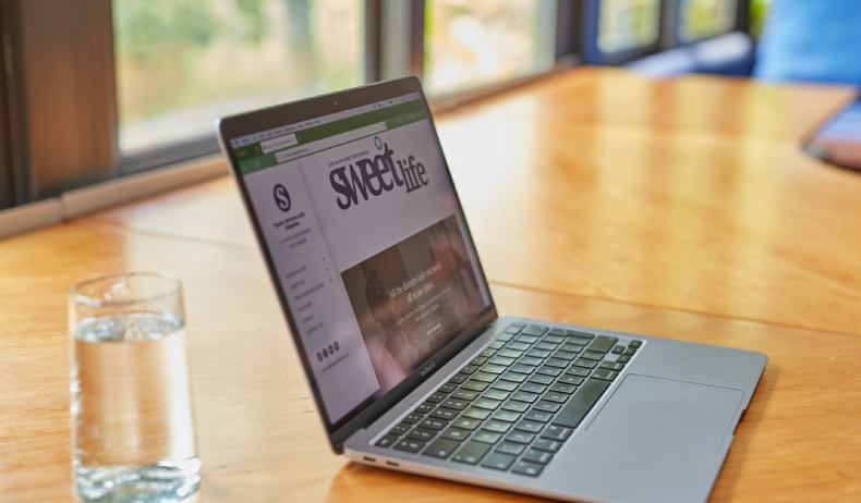 Laptop in small cafe table with a small business website