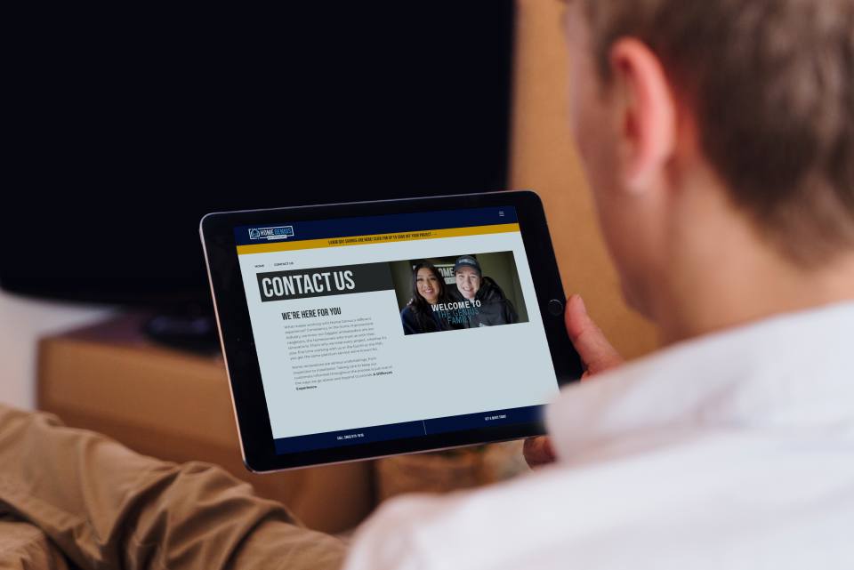 Man looking at a contact page on a tablet