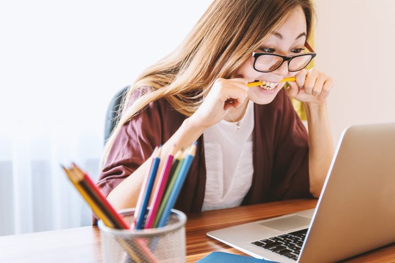 Woman frustrated at computer.