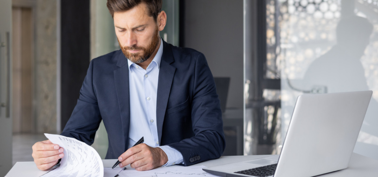 Business owner reviewing his business costs