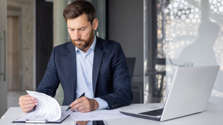 Business owner reviewing his business costs