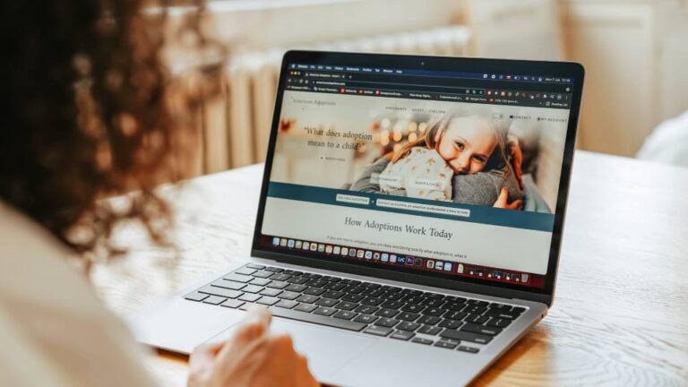 Website service page displayed on a laptop